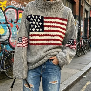 American flag-patterned turtleneck sweater features a striking flag design on the chest and delicate flag embellishments on the sleeves,